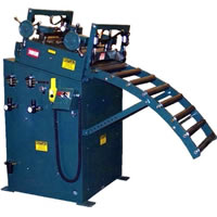An entry stock roller support and an upper roller guide directs the flow of material from pull-off type stock reels. Large vertical rollers are hardened and adjustable for edge guidance of material.
